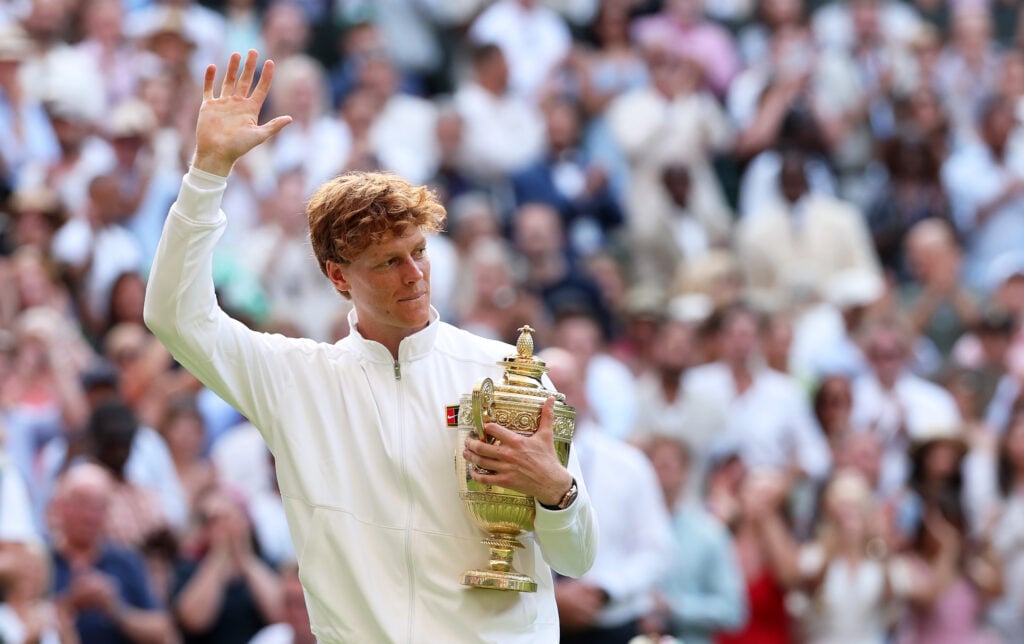 Jannik Sinner waves to the fans after winning the 2025 Wimbledon final