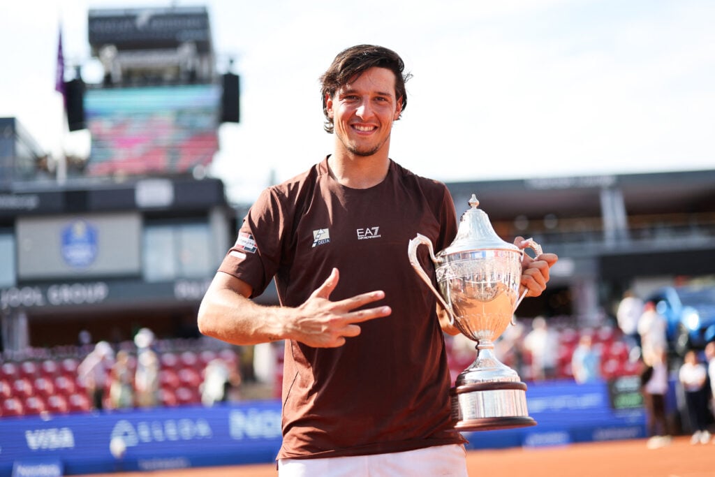 Luciano Darderi poses with the trophy after winning the men's singles final match against Netherlands' Jesper de Jong at the ATP Nordea Open tennis tournament in Bastad, Sweden.
