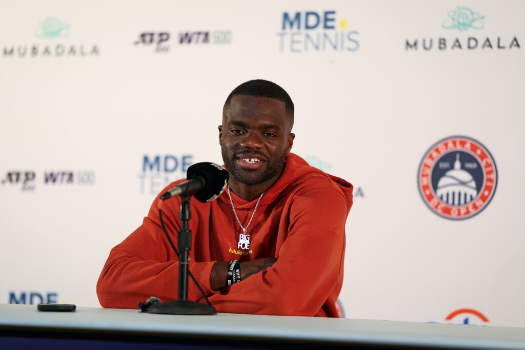 Frances Tiafoe speaks into a microphone