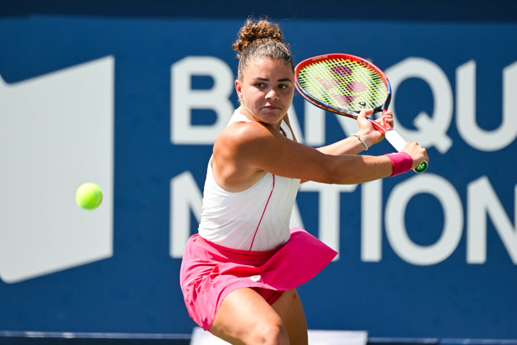 Jasmine Paolini hits a backhand during her opening match at the 2025 National Bank Open