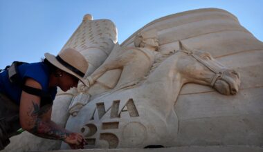 Sculptor Melineige Beauregard worked on “Revolutions Start Here,” the centerpiece of the 21st annual Revere Beach International Sand Sculpting Festival.
