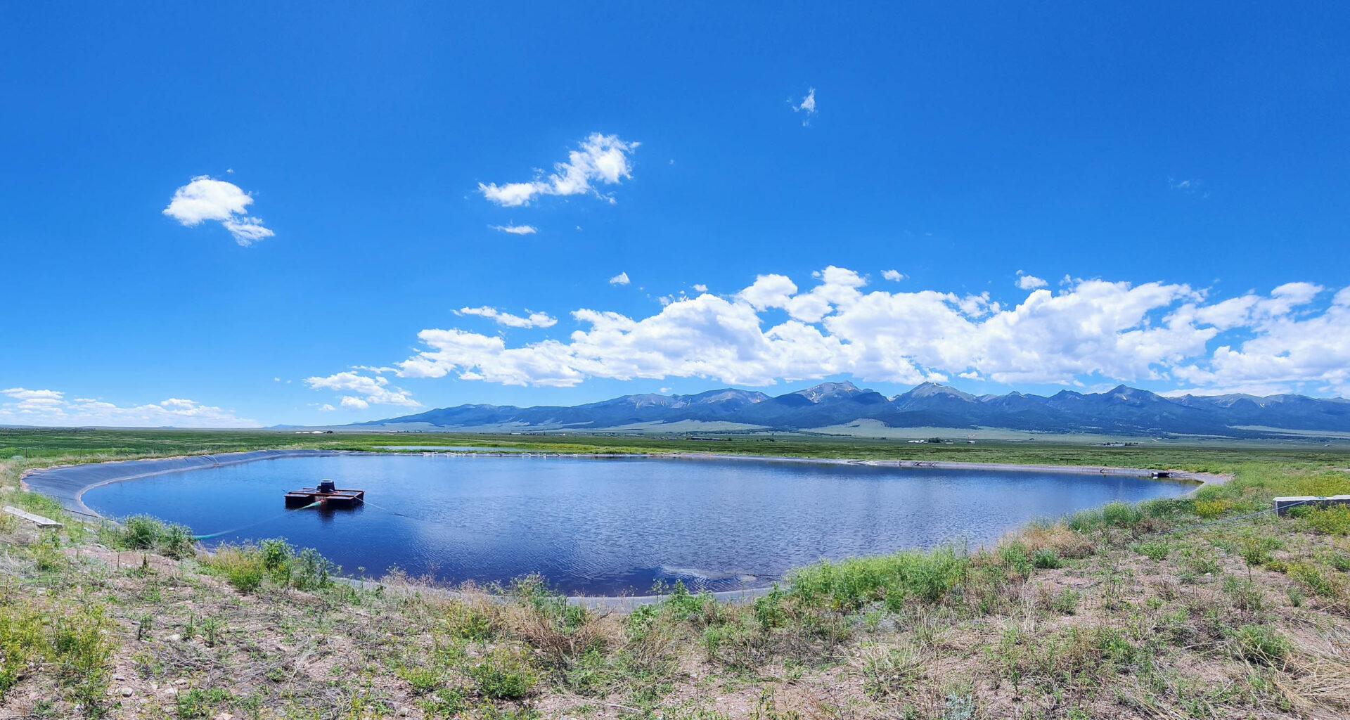 a pond in a mountain valley