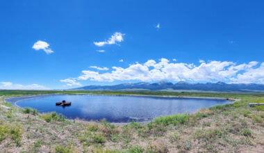 a pond in a mountain valley