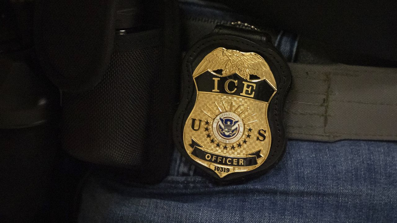 ICE officer badge. (AP Photo/Yuki Iwamura)