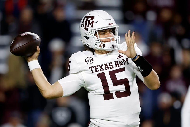 Texas A&M quarterback Conner Weigman warms up before a game against Auburn, Saturday, Nov. 23, 2024, in Auburn, Ala.