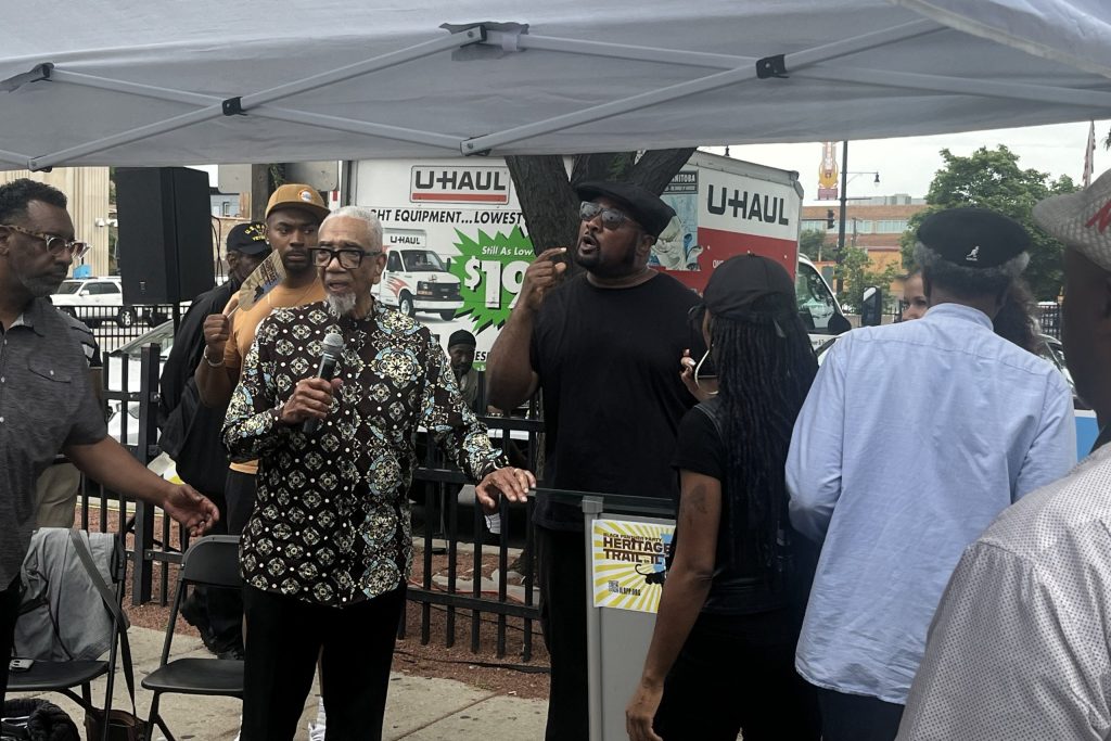 Former Congressman Bobby Rush and Fred Hampton Jr. speak during the unveiling ceremony for a plaque at 2350 W. Madison St. on July 26, 2025.