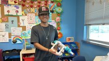 Pedro Colex holds the underwater drone he has designed with a classmate. It's part of the Camp Submerge program at the City Heights Swim Center, this summer, July 24, 2025. 
