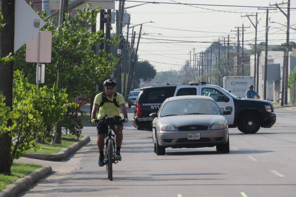 Police demonstrate bike safety enforcement near downtown Houston. 