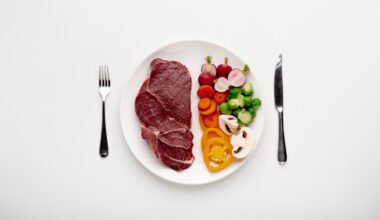 Served plate with meat and vegetables, top view