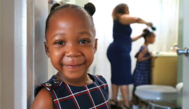 Diana Cortes worked on the hair of daughter, Arya, 5, as her sister, Layla, stood in the doorway to the bathroom in their Methuen apartment. Medicaid covered Layla's life-saving liver transplant in June 2023.