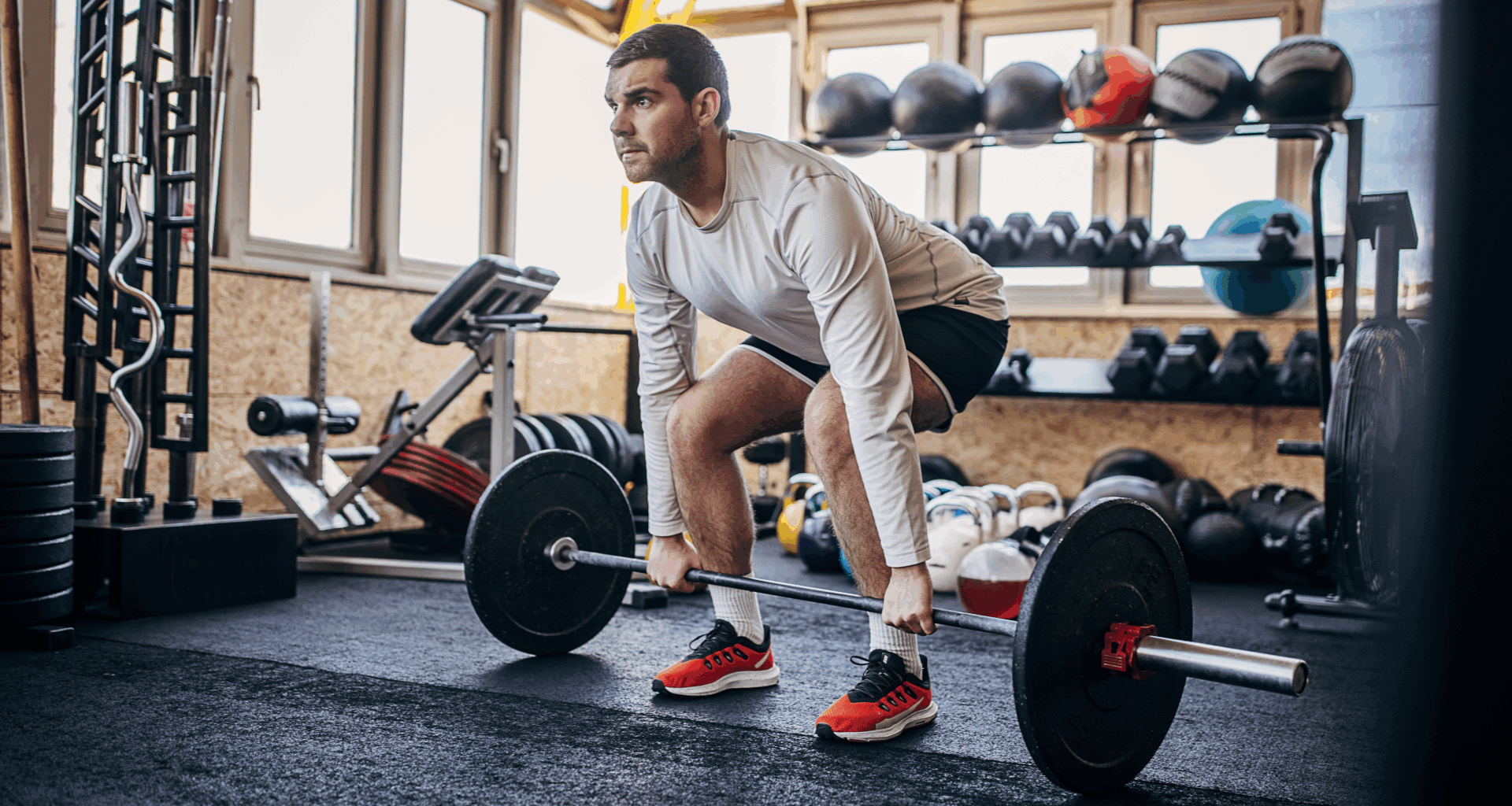 A man performing a deadlift at the gym