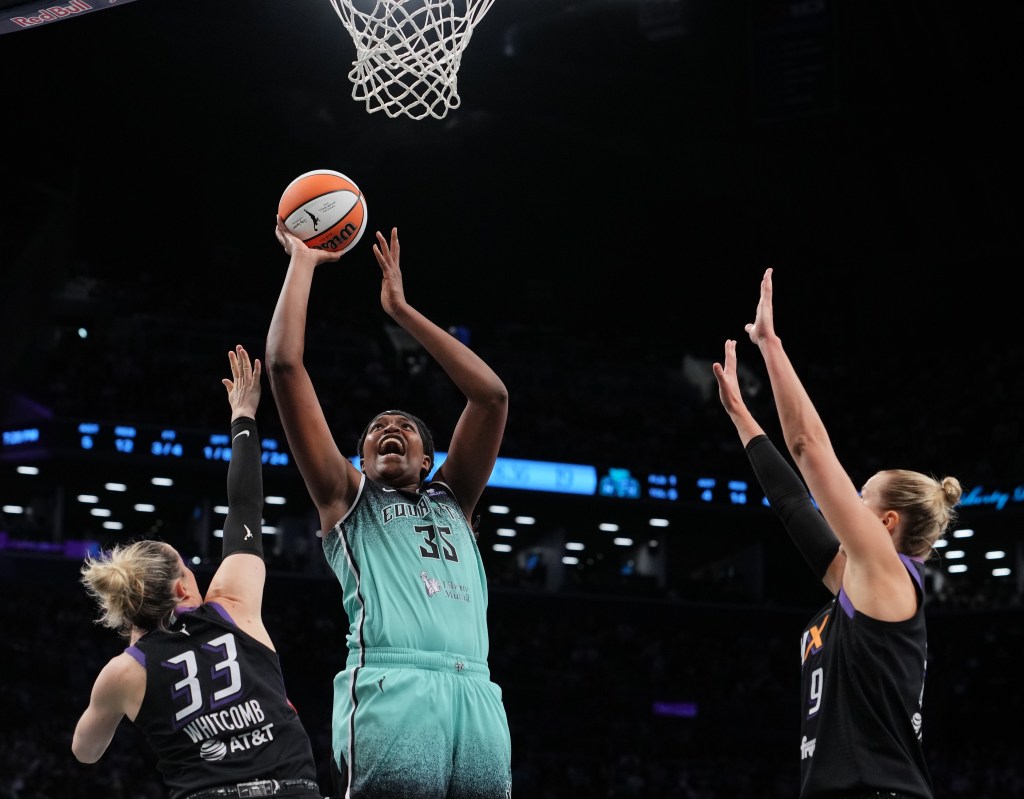 Jonquel Jones, who is out with an ankle injury again, goes up for a shot during the Liberty's loss to the Mercury on June 19, 2025.