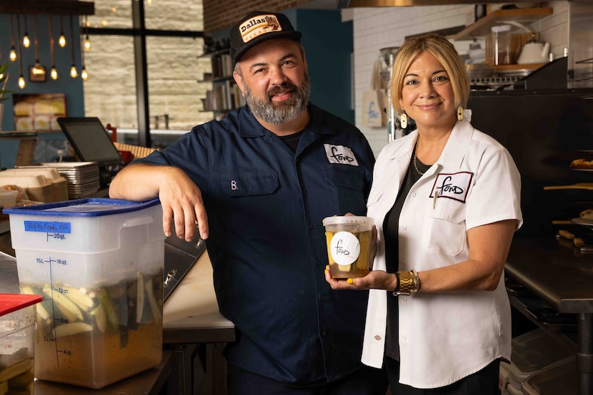 Chef and owners Brandon Moore and Jennie Kelley pose with pickles at Fond in Dallas on...