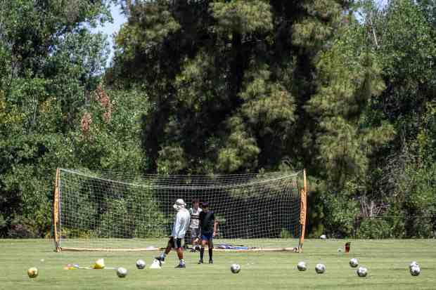 People practice soccer at at Woodley Park in Van Nuys...