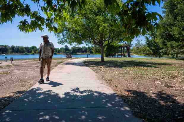 A man walks at Lake Balboa Park. in Van Nuys...