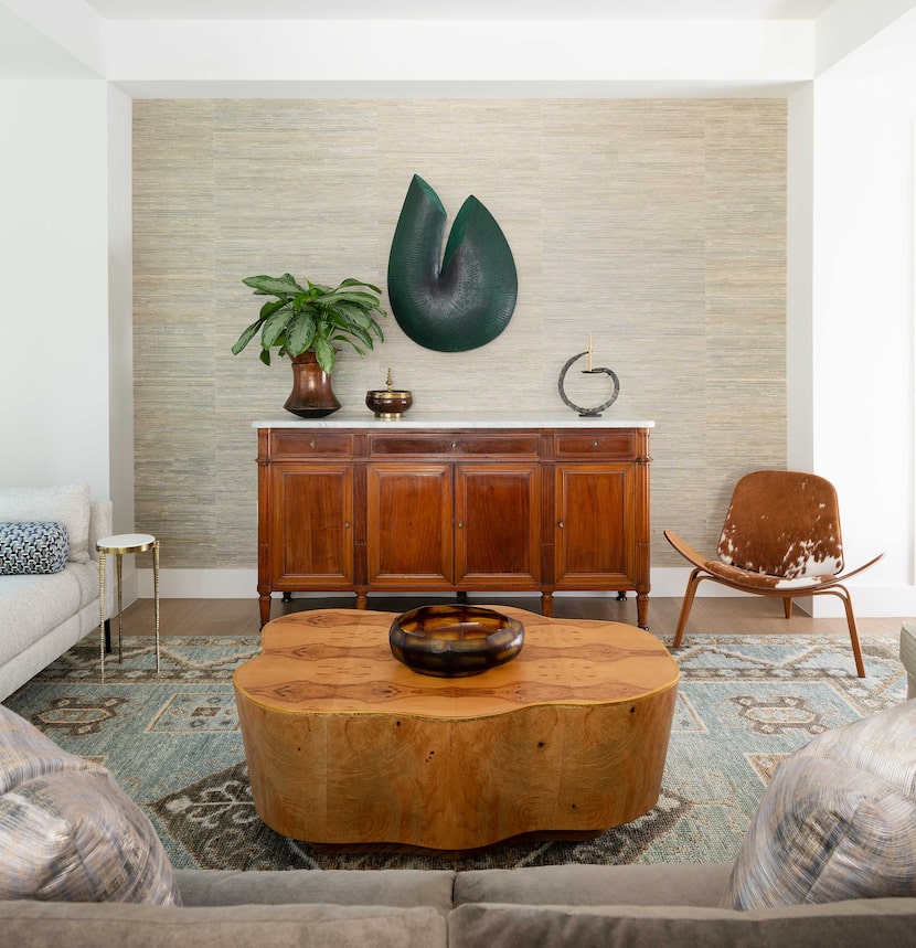 The formal living room is an eclectic mix of traditional antique pieces, contemporary...