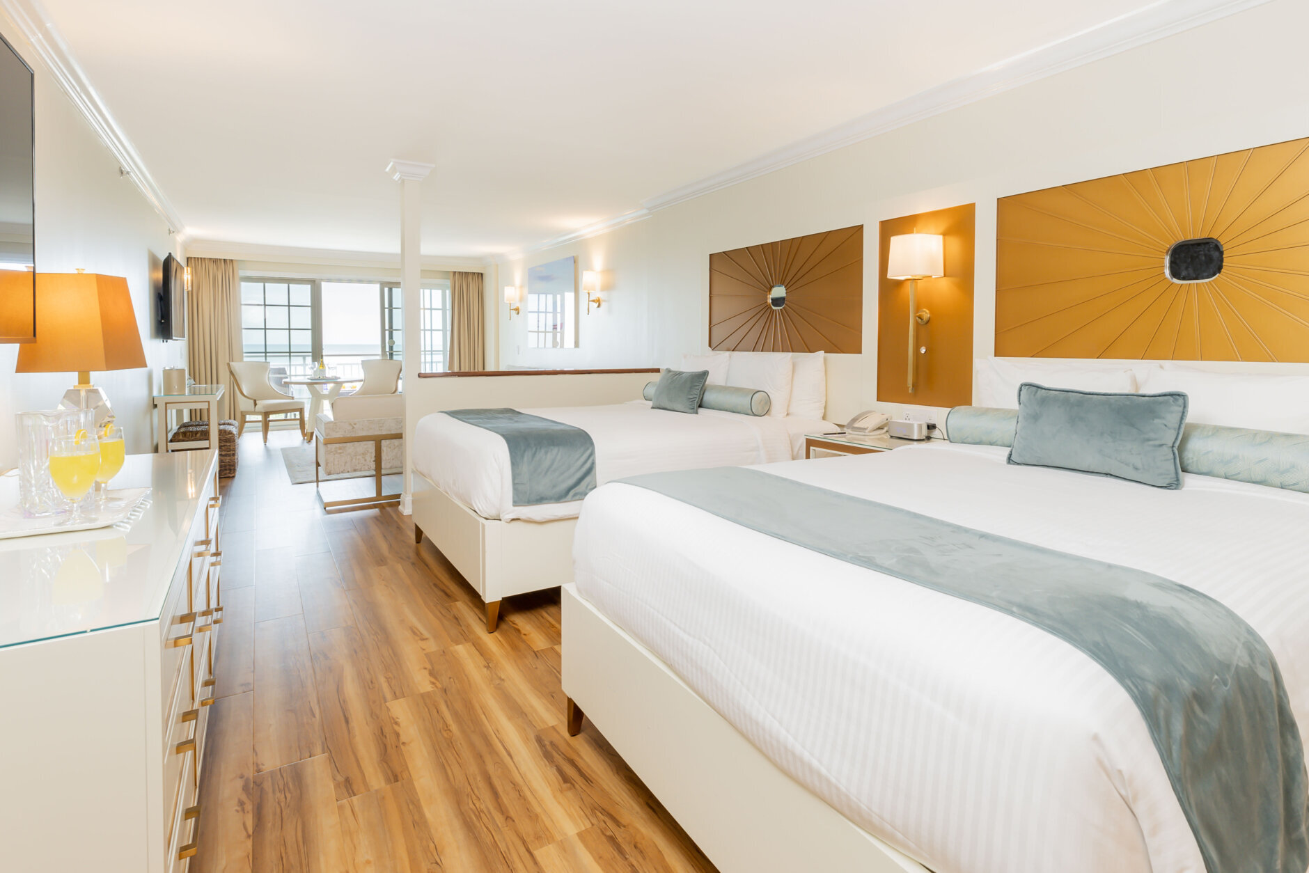 A look inside a hotel room with a balcony view at La Mer Beachfront Resort.