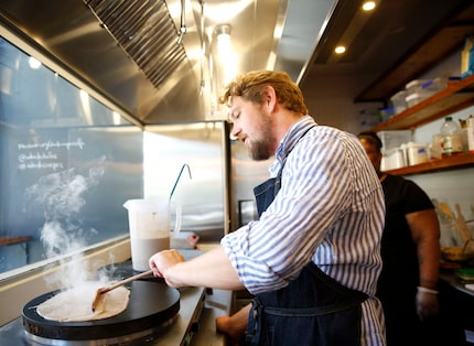Whisk Crepes Cafe founder Julien Eelsen makes the French dish his restaurant is known for in...