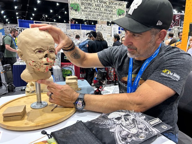 Forensic sculptor Joe Mullins works on the facial recreation of...