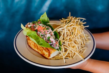 Clark's Oyster Bar's lobster roll, $39, comes with drawn butter and shoestring fries. The...
