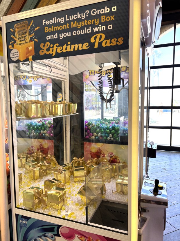 Through Sept. 1, Belmont Park visitors could win a lifetime pass if they capture the right box in this claw machine. (Elaine Alfaro)