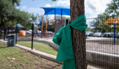 Green ribbons in Alamo Heights honor those missing in floods
