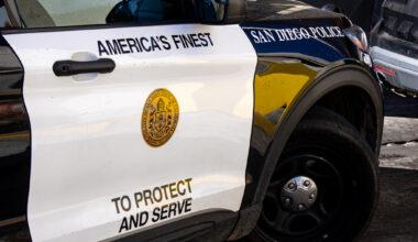 San Diego Police parked in the middle of the road to talk to a man yelling in Hillcrest on Dec. 20, 2022.