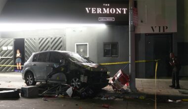 A vehicle sits on the sidewalk after ramming into a crowd of people waiting to enter a nightclub along a busy boulevard in Los Angeles, July 19, injuring several people.