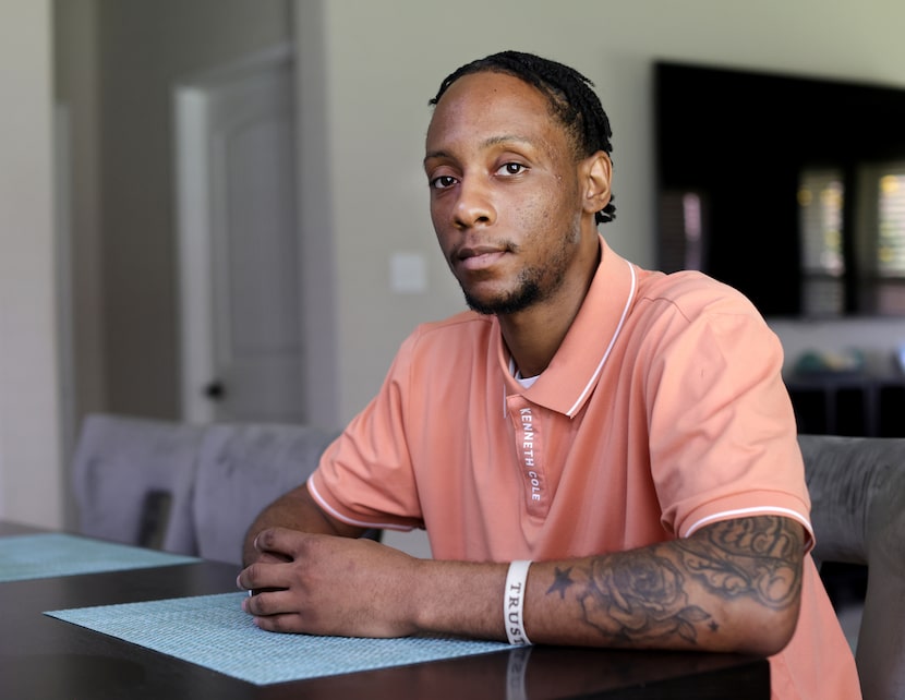 Darius Richardson poses for a photograph at his girlfriend's mother's home in Fort Worth,...