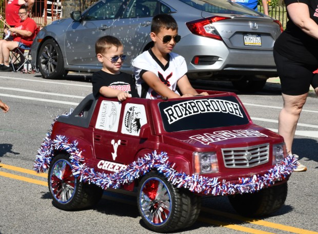 Declan and Keegan Clark ride in style in the Roxborough...
