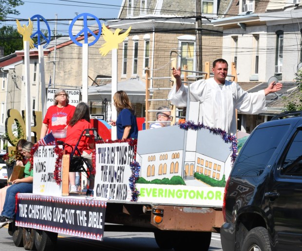 St. James Dougherty leads the throng on the creative Leverington Church theme float. (Photo by Rick Cawley)