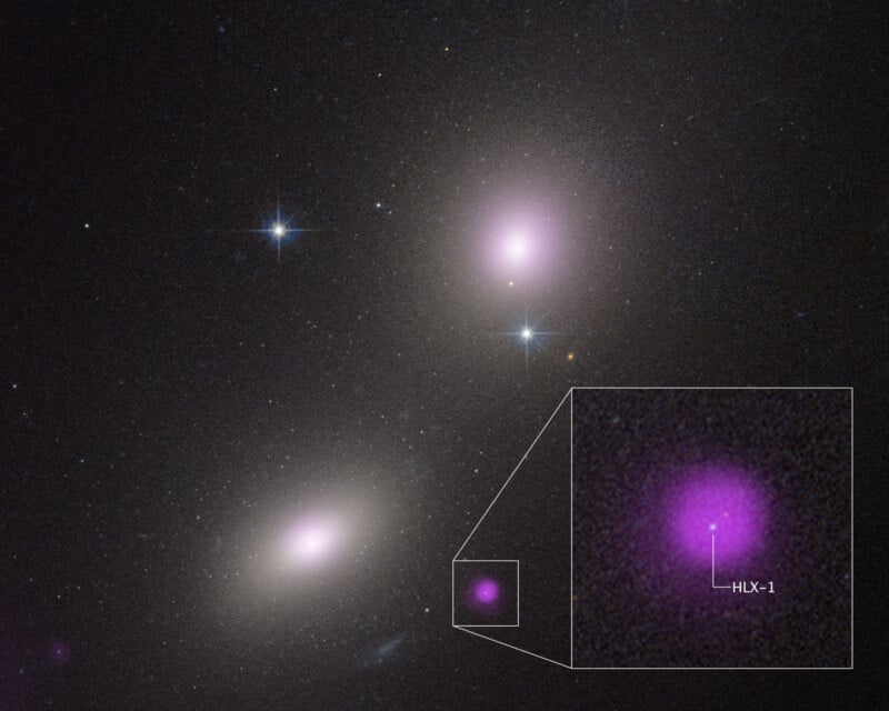 A space image shows two bright galaxies with glowing pink centers and several stars. An inset zooms in on a smaller pink spot labeled "HLX-1," highlighting a detail within the cosmic scene.