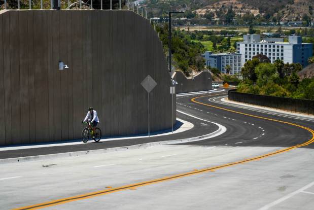 Bachman Place, a road that is known by many locals as a short cut, has reopened. The street takes you from Mission Valley to Hillcrest. Aaron Petka 52, with the Mission Hills Bike Shop riding his bicycle uphill for the second time on the road in Hillcrest on June 9, 2025, in San Diego, California. (Alejandro Tamayo / The San Diego Union-Tribune)