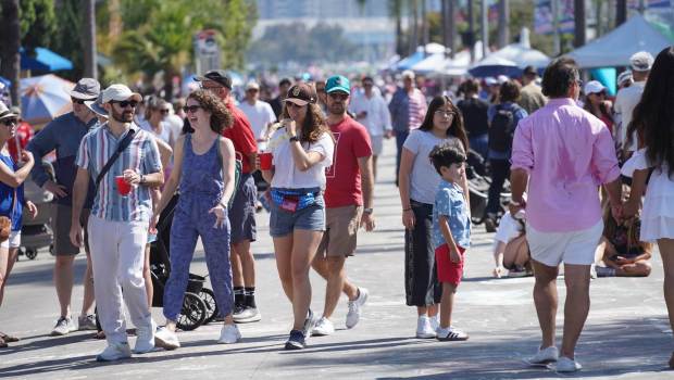 ....People walk at Orange Ave before the parade begins on Friday, July 4, 2025 in Coronado, CA. (Michael Ho / The San Diego Union-Tribune)