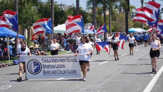 ....Students from the Chula Vista High School Spartan Legion Band and Color Guard dance at Orange Ave during the parade on Friday, July 4, 2025 in Coronado, CA. (Michael Ho / The San Diego Union-Tribune)
