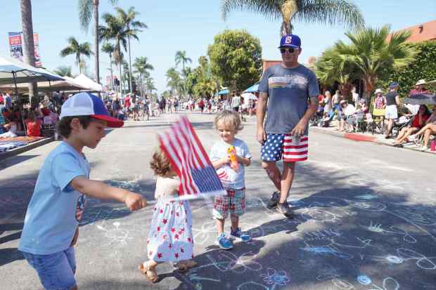 ....Finlay Bryant brings his kids to the parade at Orange Ave on Friday, July 4, 2025 in Coronado, CA. (Michael Ho / The San Diego Union-Tribune)