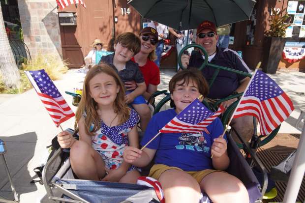 Andrew Hamilton brings his family to Orange Ave early morning to secure their seats for the parade on Friday, July 4, 2025 in Coronado, CA. (Michael Ho / The San Diego Union-Tribune)