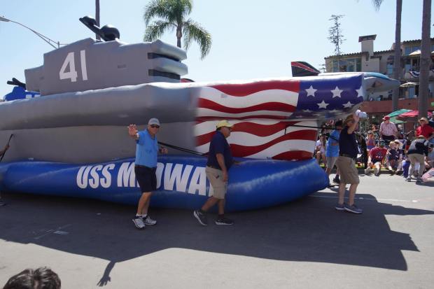 ....People from the USS Midway Museum drive a truck that modified like a warship during the parade on Friday, July 4, 2025 in Coronado, CA. (Michael Ho / The San Diego Union-Tribune)