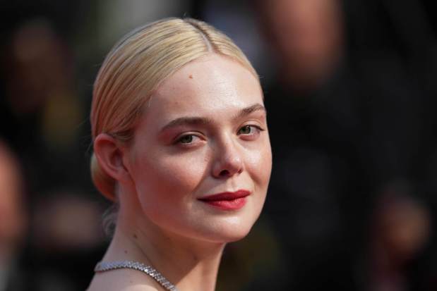 Elle Fanning poses for photographers at the 78th international film festival, Cannes, southern France, Saturday, May 24, 2025. She'll be at Comic-Con in San Diego to discuss "Predator: Badlands." (AP Photo/Natacha Pisarenko)