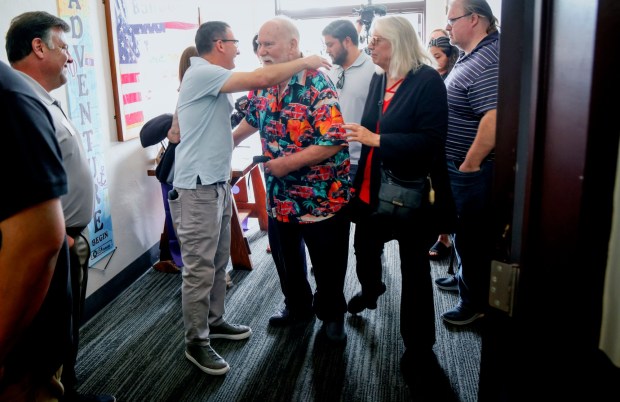 Gordon Anderson shares a moment with former workmates, family and friends during a retirement celebration at the VFW Hall in La Mesa on Friday, July 18, 2025. Anderson spent 56 years as an EMT and was one of the first in San Diego County.(Photo by Sandy Huffaker for The San Diego Union-Tribune)