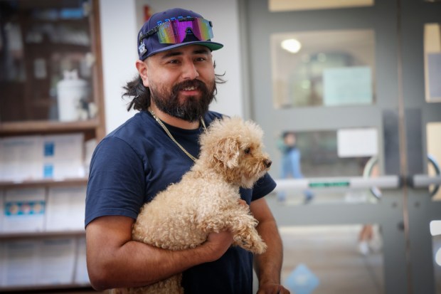 Angel Contreras shares a moment with his dog Daisy after reuniting at the San Diego Humane Society on Sunday, July 6, 2025. Daisy ran-off from his back yard after reacting to fireworks on July 4th and ended up at the Humane Society shelter. (Photo by Sandy Huffaker for The San Diego Union-Tribune)