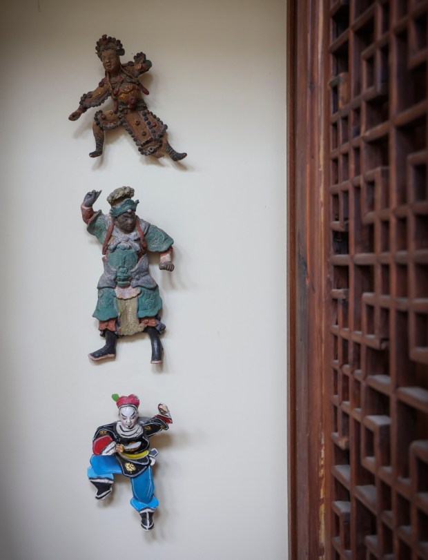 Chinese roof ornaments on display at a home in Point Loma on Thursday, June 19, 2025. Designer Diana Clark offers tips on how to get the most bang for your buck and what to look for when shopping in thrift stores, consignment stores, Facebook Marketplace and the like.. (Photo by Sandy Huffaker for The San Diego Union-Tribune)