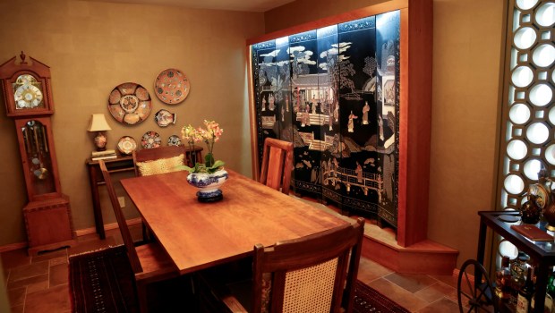 A dining room table and a Japanese screen,R, on display at a home in Point Loma on Thursday, June 19, 2025. Designer Diana Clark offers tips on how to get the most bang for your buck and what to look for when shopping in thrift stores, consignment stores, Facebook Marketplace and the like.. (Photo by Sandy Huffaker for The San Diego Union-Tribune)