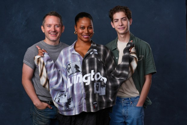 Elijah Wood, from left, Taylour Paige, and Jacob Tremblay pose for a portrait to promote "The Toxic Avenger" during Comic-Con International on Thursday, July 24, 2025, in San Diego. (AP Photo/Chris Pizzello)