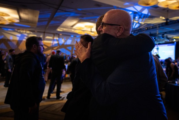 Jon Macy hugs another author after the Eisner Awards ceremony on Friday, July 25, 2025 in San Diego, California. Macy was nominated for two Eisners. (Ana Ramirez / The San Diego Union-Tribune)