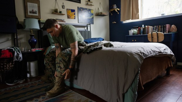 Marine Capt. Sye Savoie gets dressed for work on Tuesday, June 24, 2025 in Oceanside. (Ana Ramirez / The San Diego Union-Tribune)