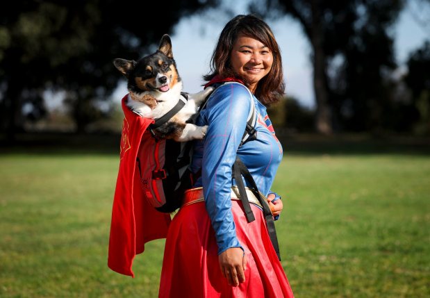 Josephine Zosa and pup Kilo pose for a photo in their costumes during the 13th annual PAWmicon event, hosted Helen Woodward Animal Center, at Balboa Park on Tuesday, July 22, 2025 in San Diego, CA. (Meg McLaughlin / The San Diego Union-Tribune)