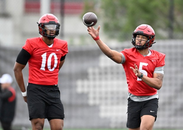 San Diego State quarterback Bert Emanuel Jr. (5) throws as quarterback Jayden Denegal Jr. (10) looks on, March, 11, 2025 in San Diego, Calif. (Photo by Denis Poroy)