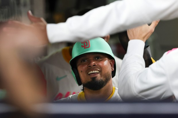 San Diego Padres' Luis Arraez is celebrated in the dugout after scoring a run against the Pittsburgh Pirates at Petco Park on Friday, May 30, 2025 in San Diego, CA. (Meg McLaughlin / The San Diego Union-Tribune)