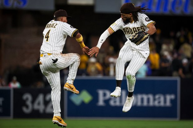 The Padres' Luis Arraez and Fernando Tatis Jr. celebrate after a win over the Nationals on Tuesday, June 24, 2025. (Meg McLaughlin / The San Diego Union-Tribune)